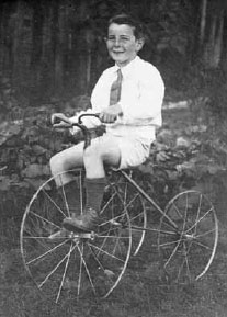 Tribe riding a bike at age 7 approx.