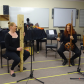 Ros and Alana playing in the Music Room UNE
