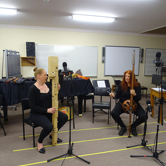Ros and Alana playing in the Music Room UNE